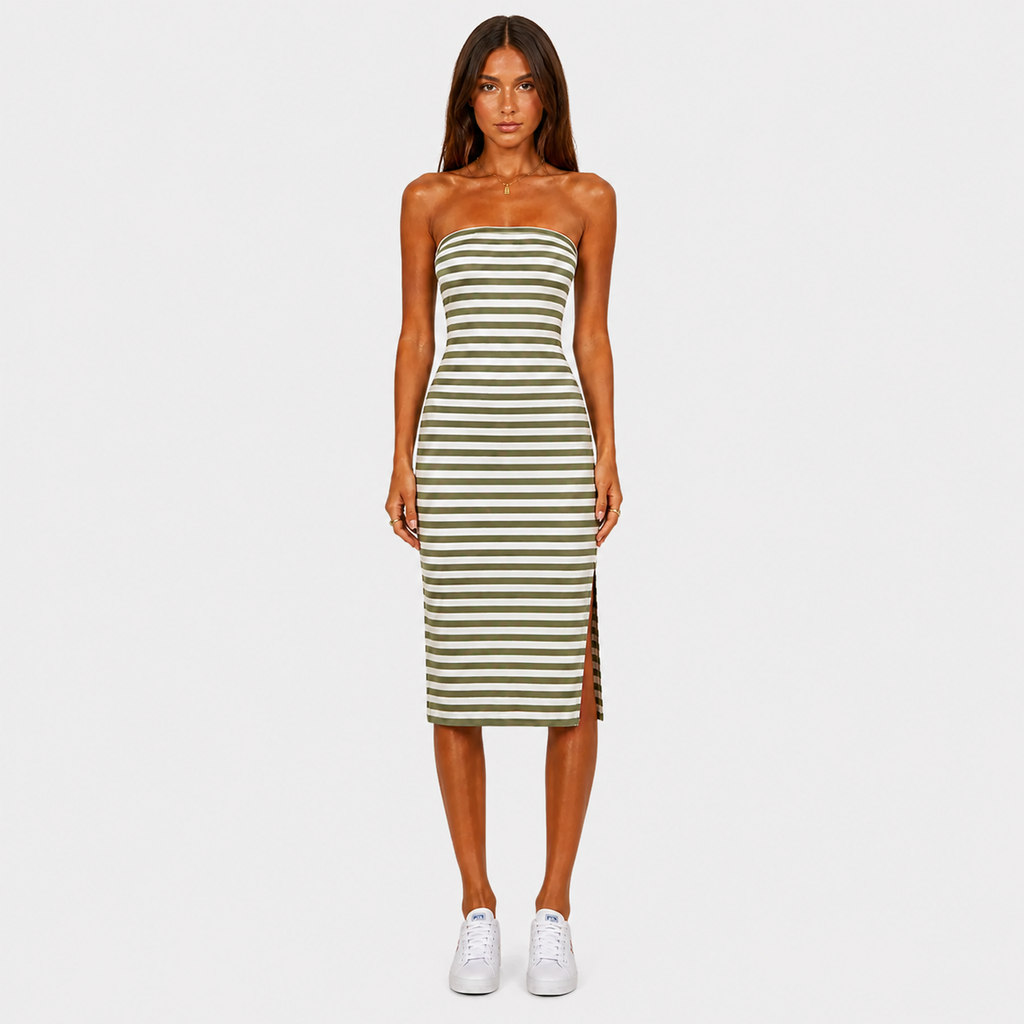 Woman wearing a strapless green and white striped dress on a white background