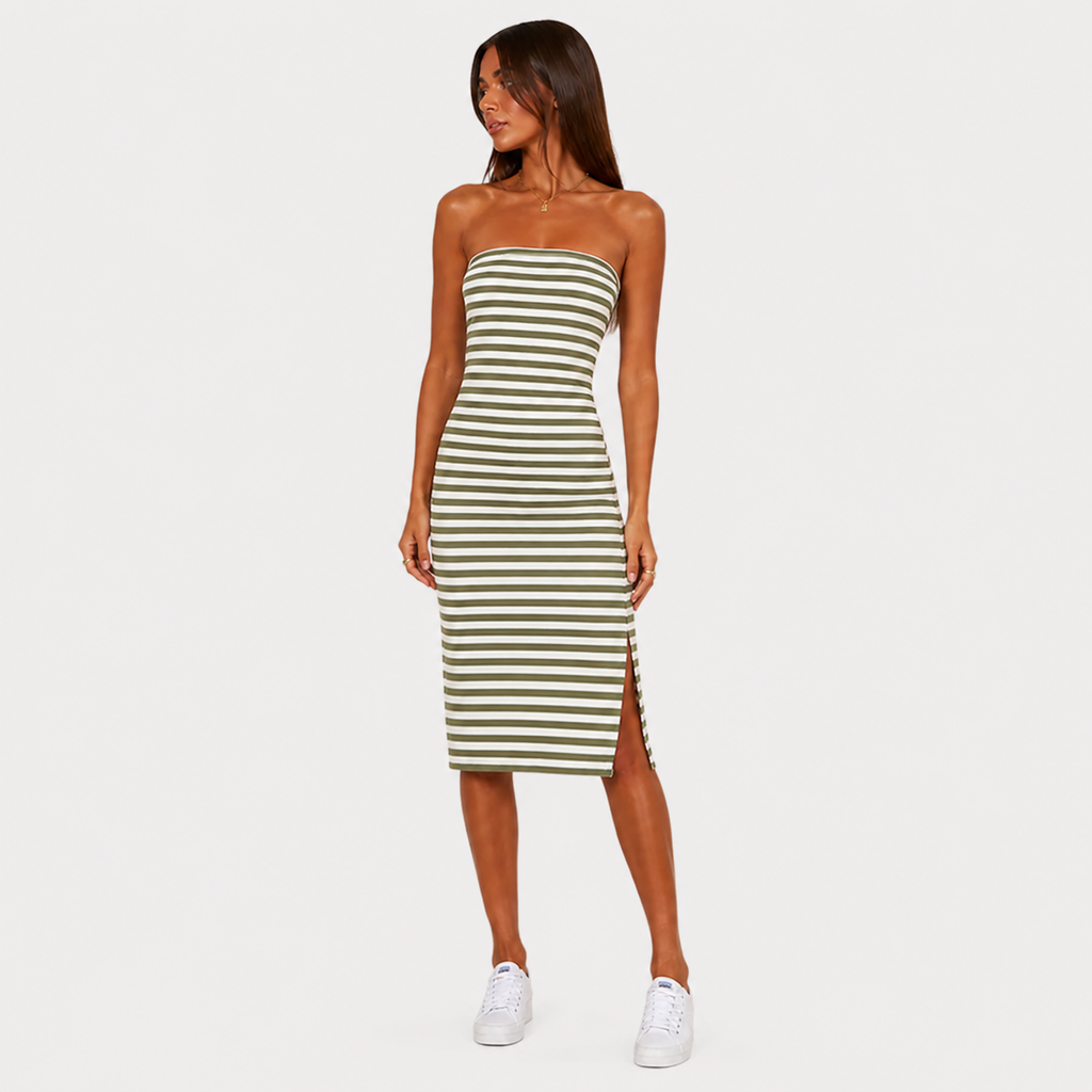 Woman wearing a green and white striped dress on a white background